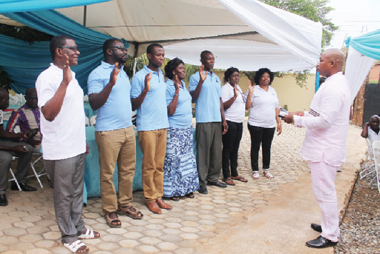 The Kokrobite District Police Commander, Deputy Superintendent of Police (DSP) Mr Simon Agbodeka, taking the executives through the swearing-in ceremony